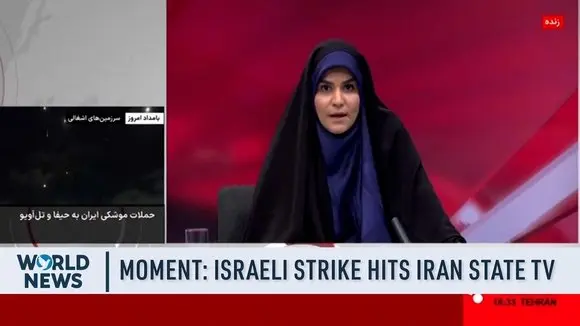 MOMENT: Iran State TV Live Broadcast Interrupted by Israeli Airstrike